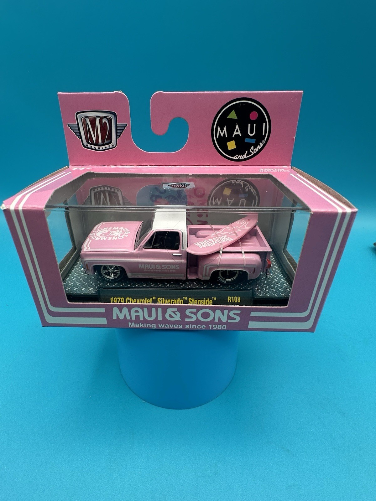 M2 Machines 1979 Chevrolet Silverado Stepside Maui & Sons Pink W/Surfboard K1