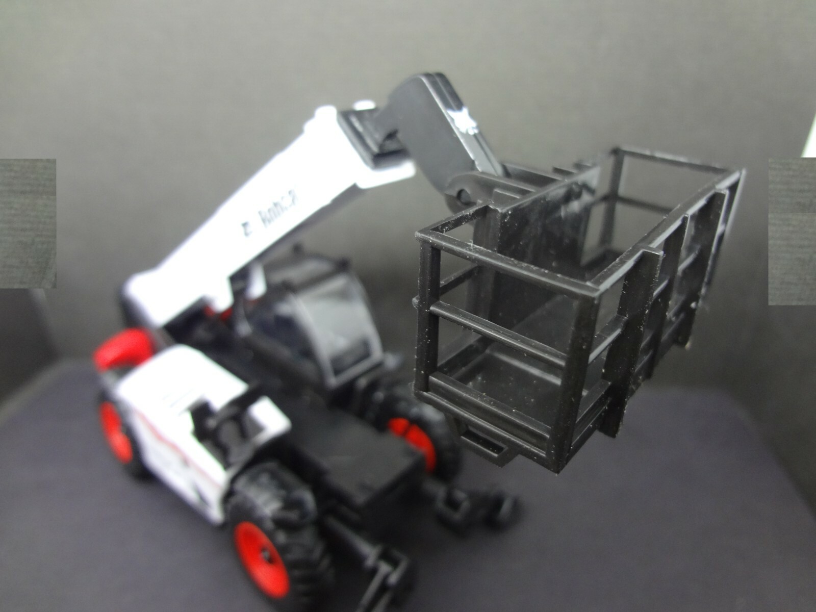 BOBCAT telescopic handler with man platform – Construction Warehouse