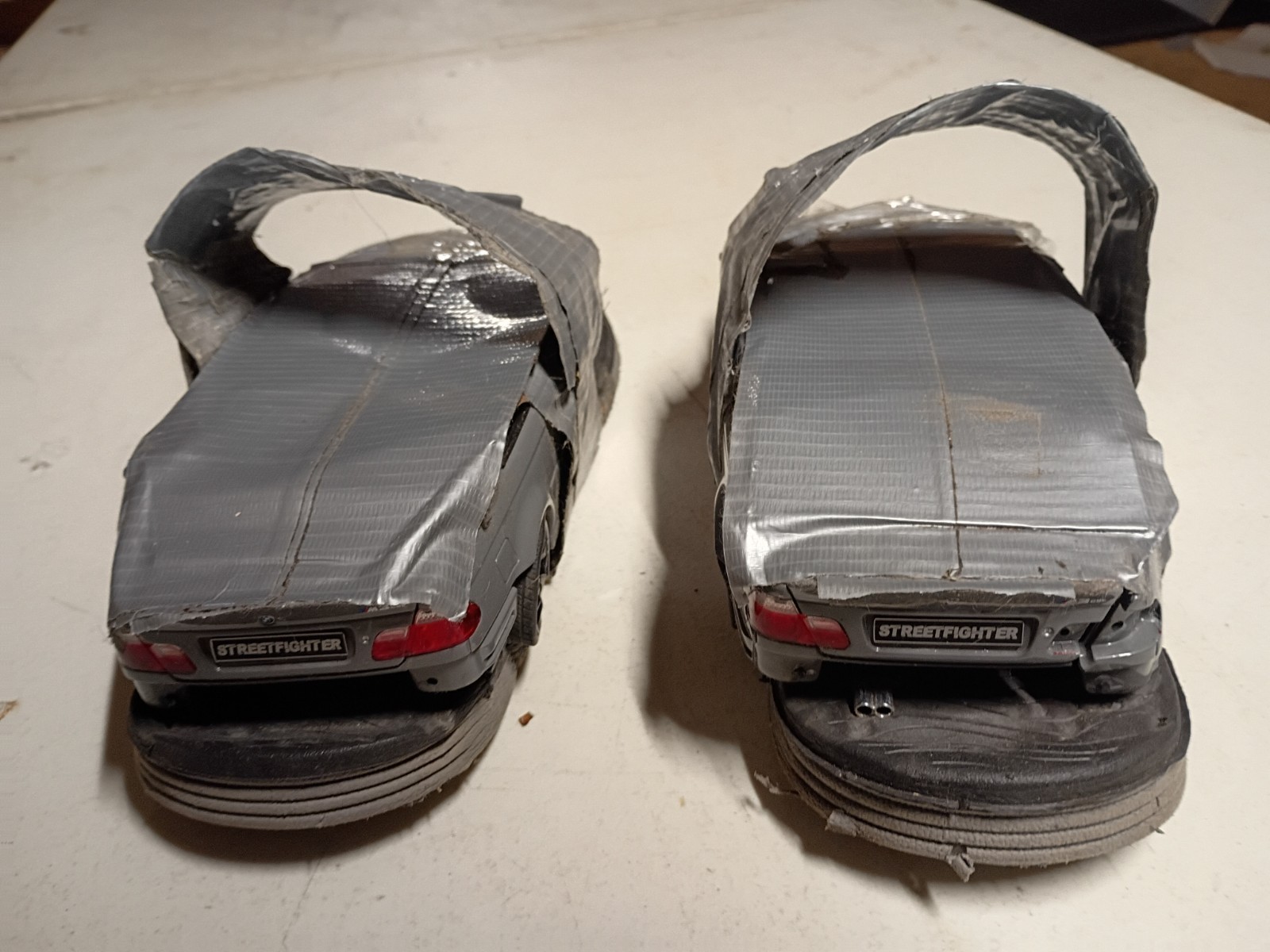 pair of Solido 2000 BMW E46 M3 Grey 1:18 flip flops crushed cars