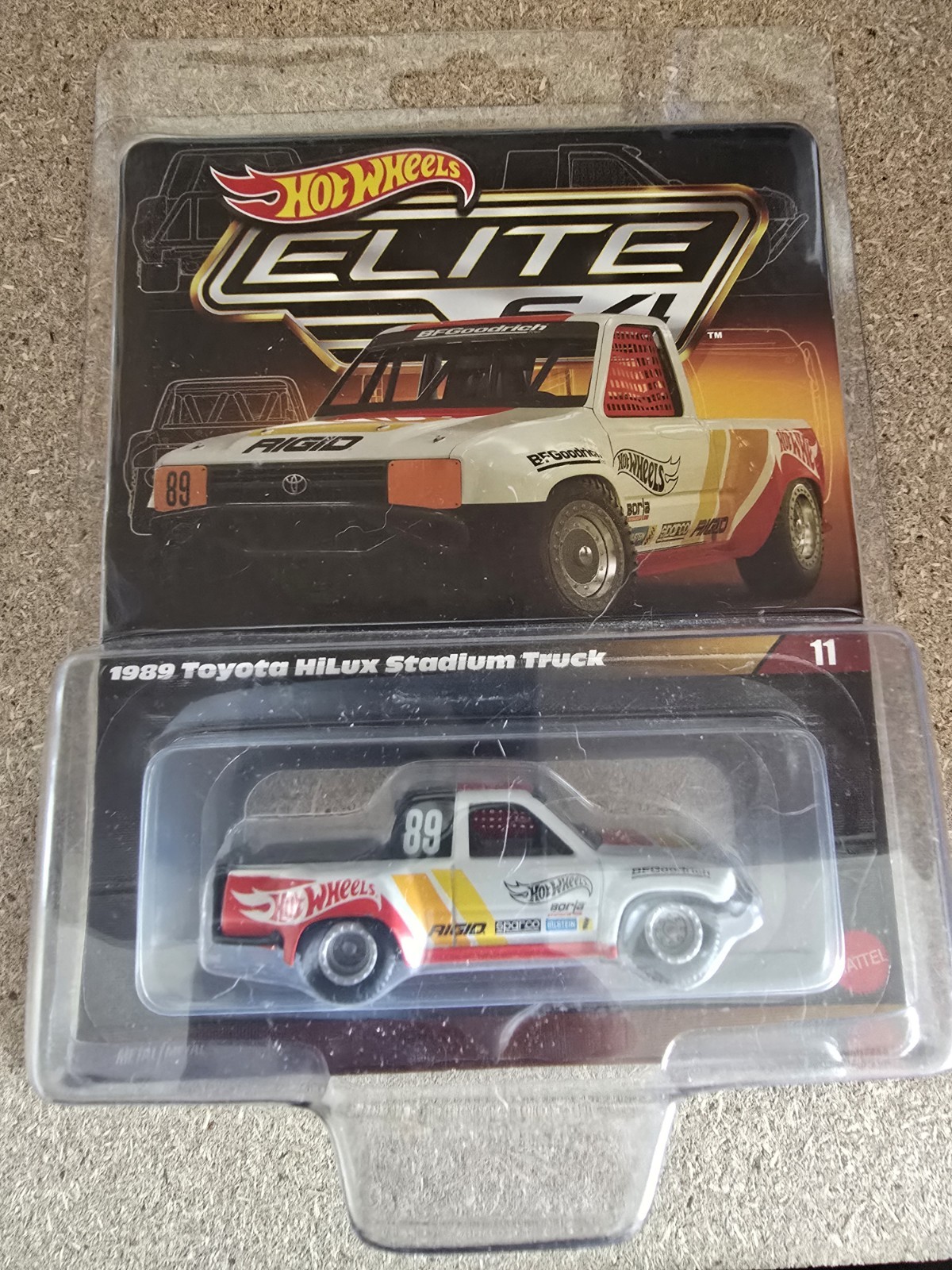 2024 Hot Wheels Elite 64 , 1989 Toyota Hilux Stadium Truck With Protector