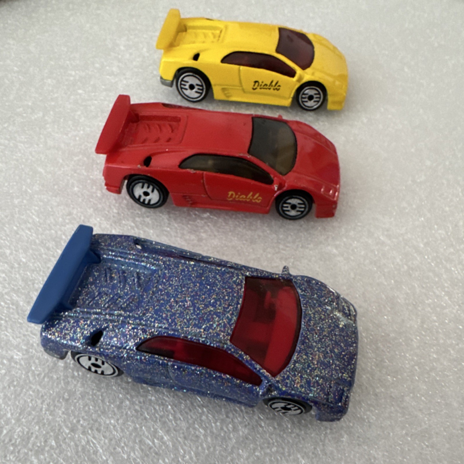 Lot of 3 Diecast Toy Cars Multicolor (Red/Yellow/Blue Glitter) Rear Spoilers