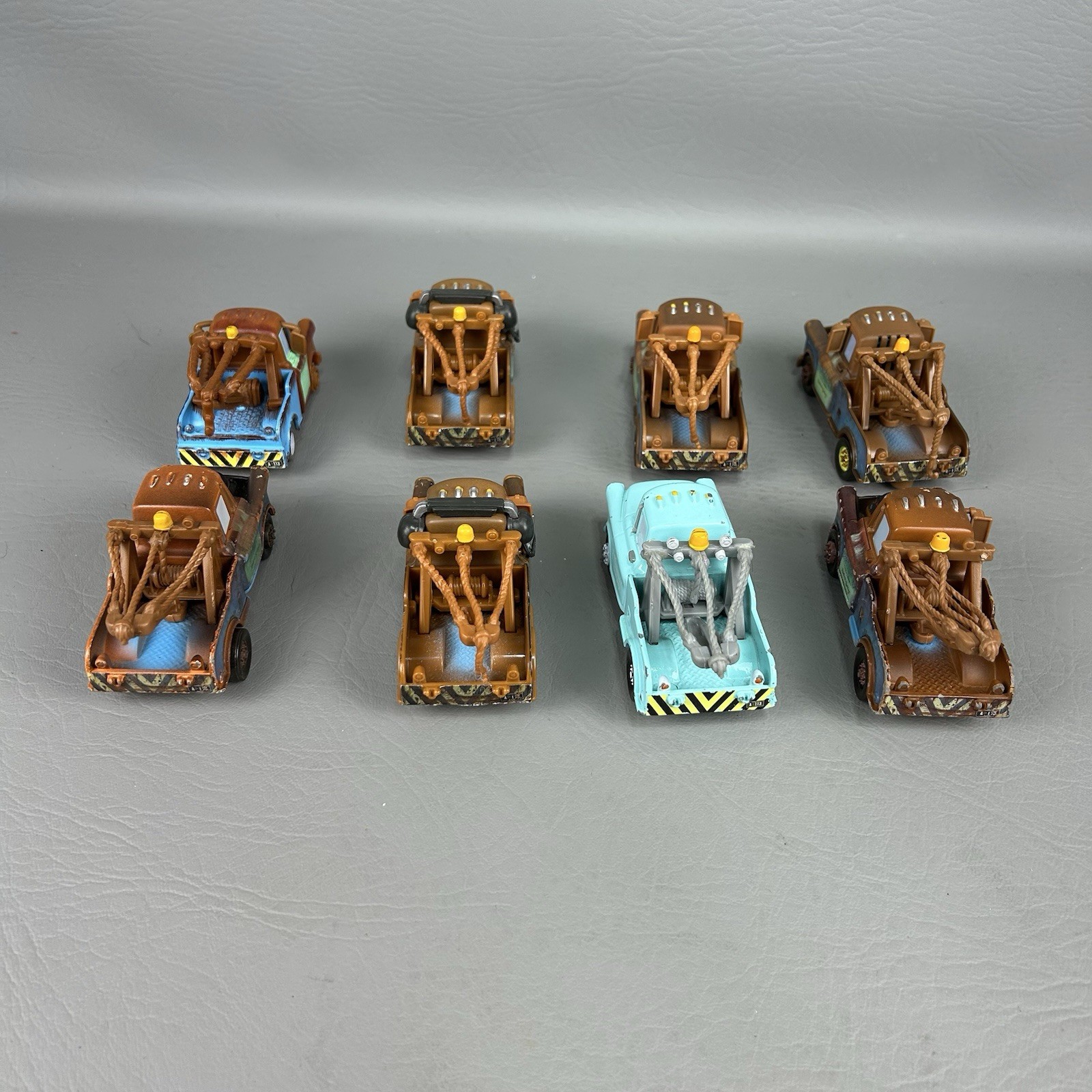 Disney Pixar Cars Diecast Tow Mater Lot of 8 One light blue Different Eyes
