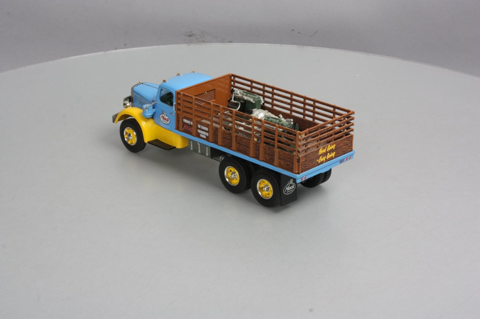 First Gear 19-3155 1:34 Scale Diecast Mack L Series Stake Truck with Engine Load