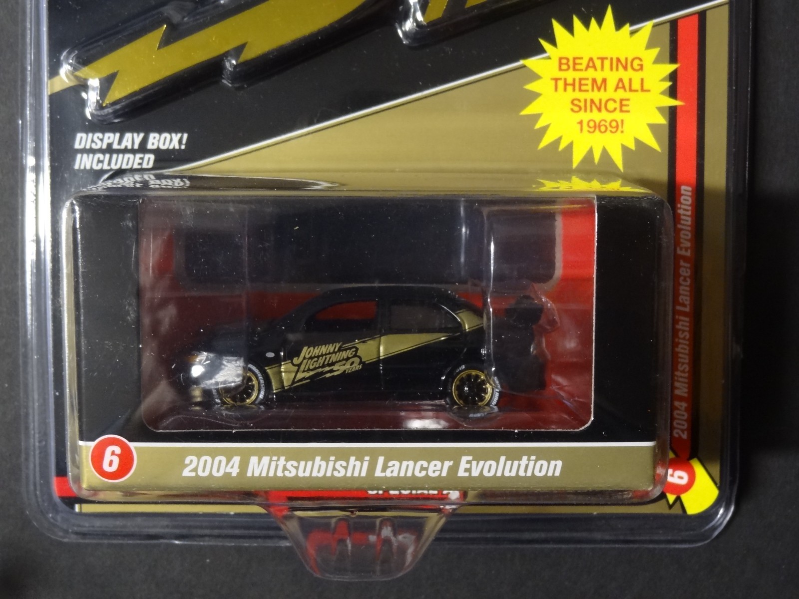 JOHNNY LIGHTNING – MIJO EXCLUSIVE – BLACK / GOLD – 2004 MITSUBISHI LANCER EVO