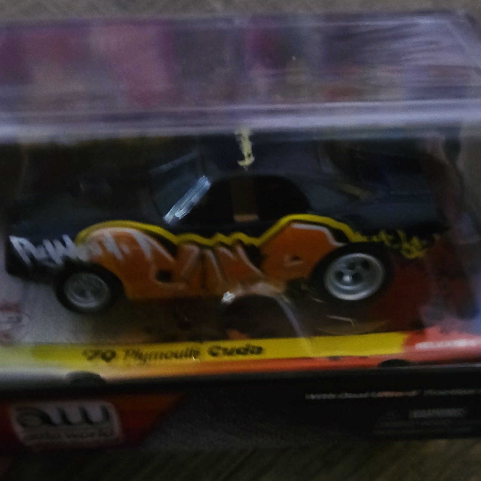 Auto World Carffiti 1:64 1970 Plymouth Cuda Orange/purple /Yellow Diecast Car