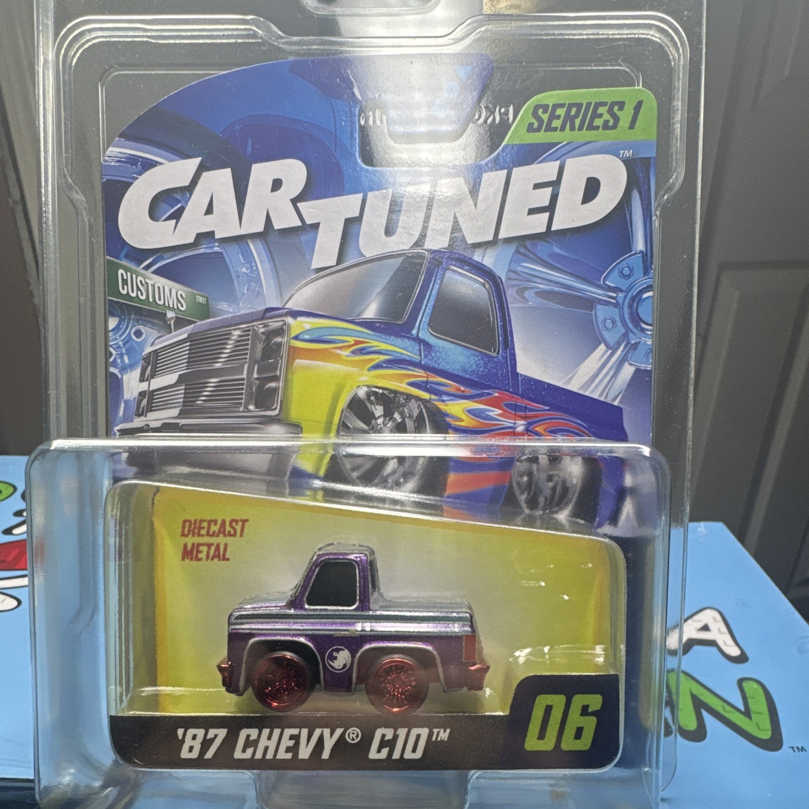 MGA Cartuned Series 1 1987 Chevy C10 Pickup #06 Diecast Purple (CHASE)