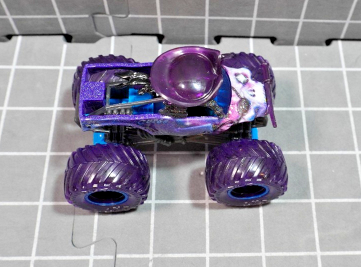 Lot of 4 Hot Wheels including Monster Jam Gears and Galaxies Pirates Curse 1/64
