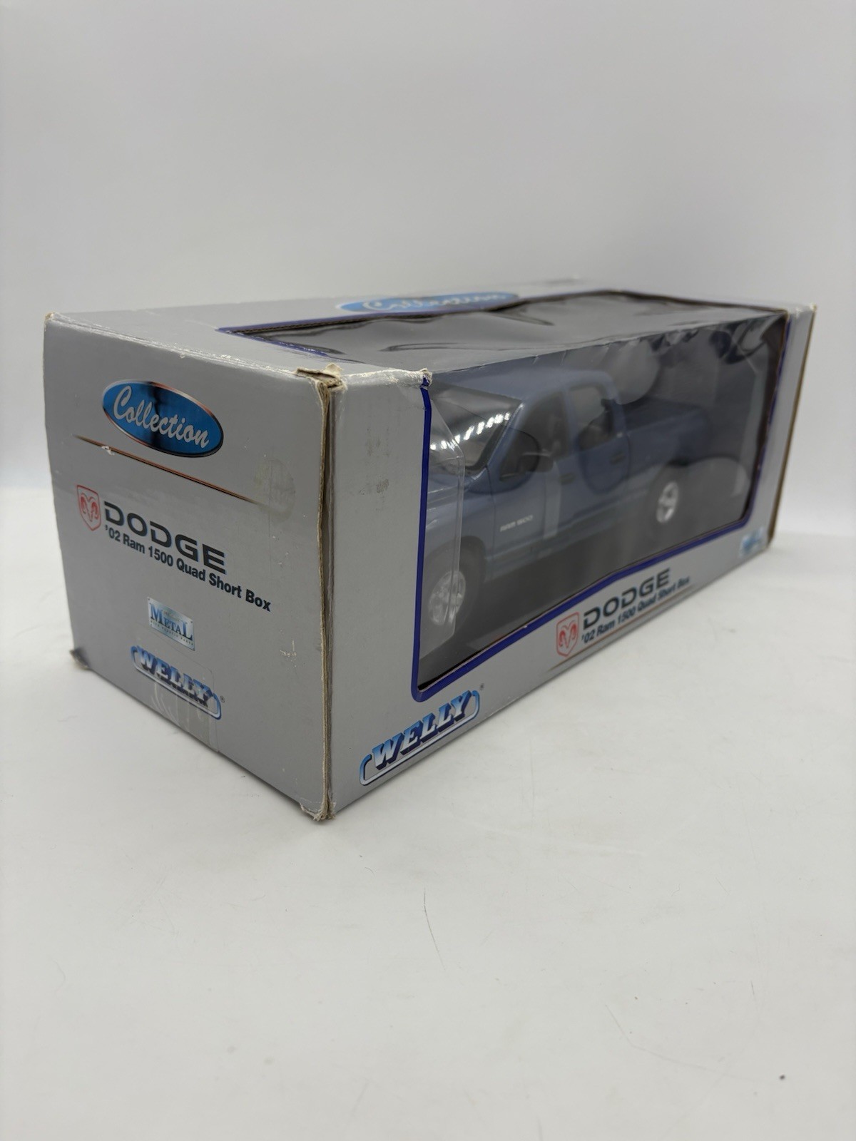 Welly 2002 Dodge Ram 1500 Quad Short Box Diecast Pickup Truck 1:19 W Box – Blue
