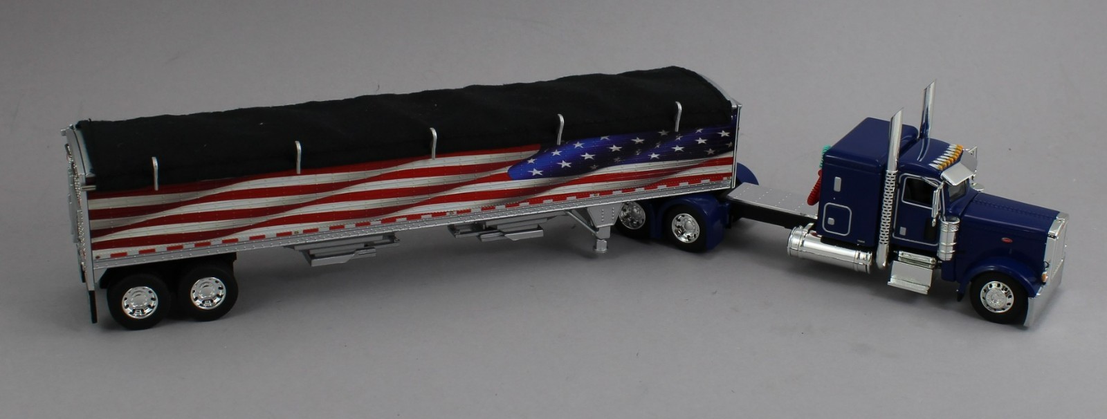 DCP 1:64 *BLUE AMERICA 250* Peterbilt 389 48″ Flattop w/Wilson Grain Trailer NIB