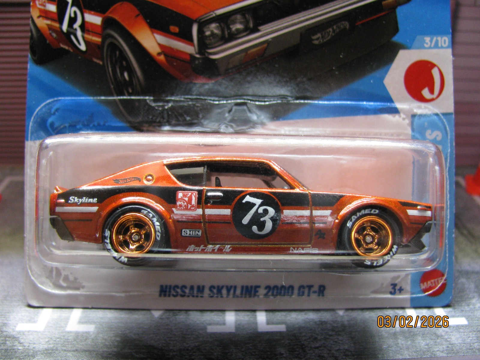 2026 Hot Wheels Burnt Orange Nissan Skyline 2000 GT-R, w/Real Riders Wheel Swap