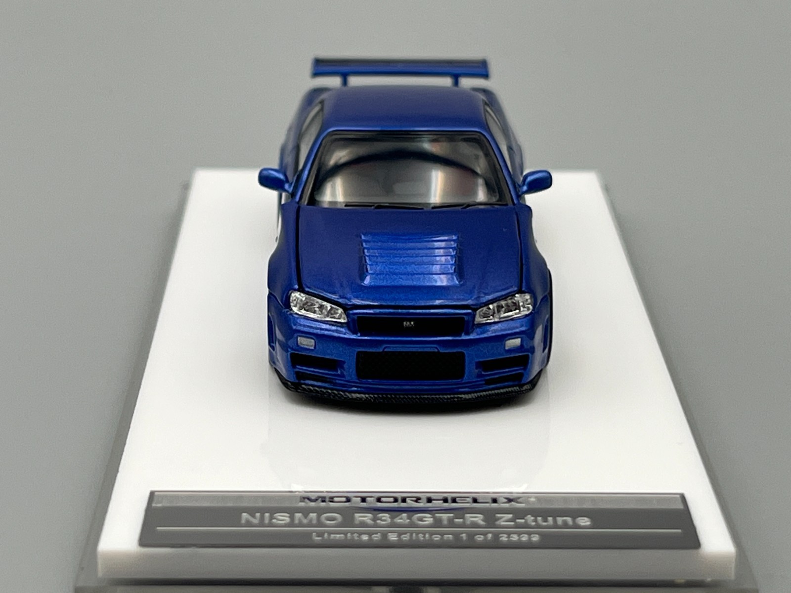 Nissan Skyline NISMO R34 GT-R Z-Tune Bayside Blue MotorHelix 1/64 scale display