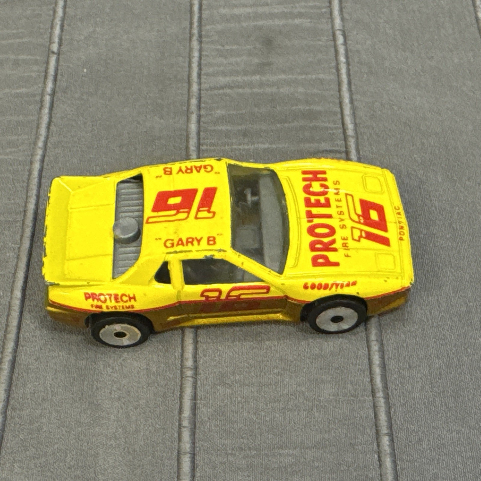 Matchbox Pontiac Fiero, Yellow, #16 Protech Fire Systems