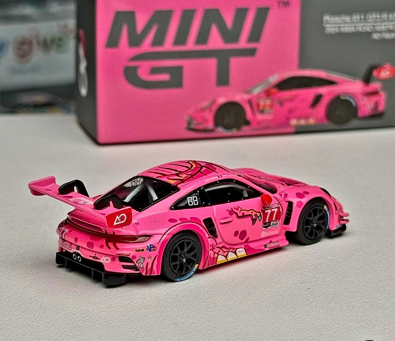 Mini GT 1:64 Porsche 911 GT3 R #77 AO Racing 2024 IMSA ROAD AMERICA