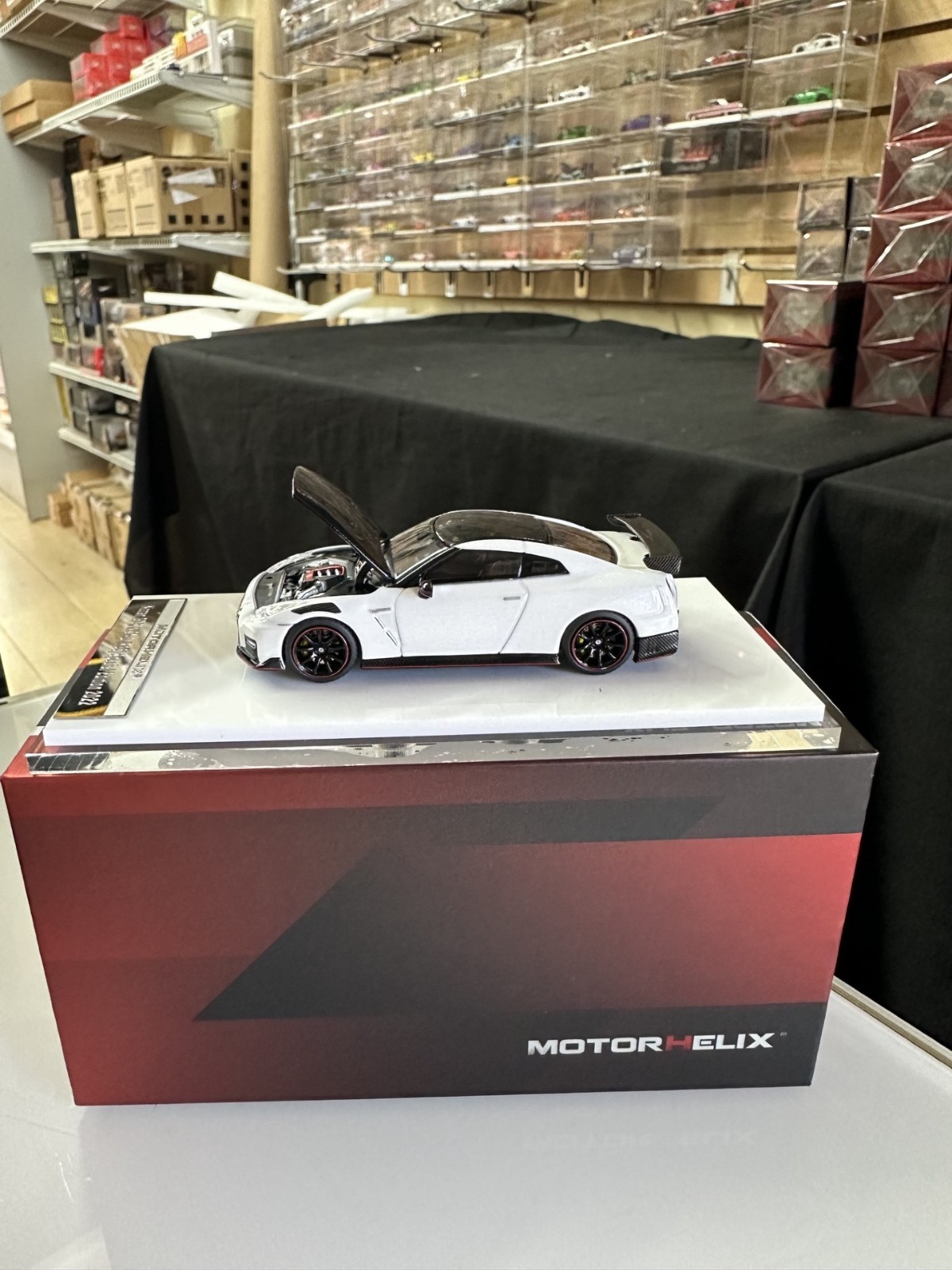 NISSAN SKYLINE GT-R R35 NISMO CARBON WHITE HOOD OPEN 1/64 CAR BY MOTORHELIX MH