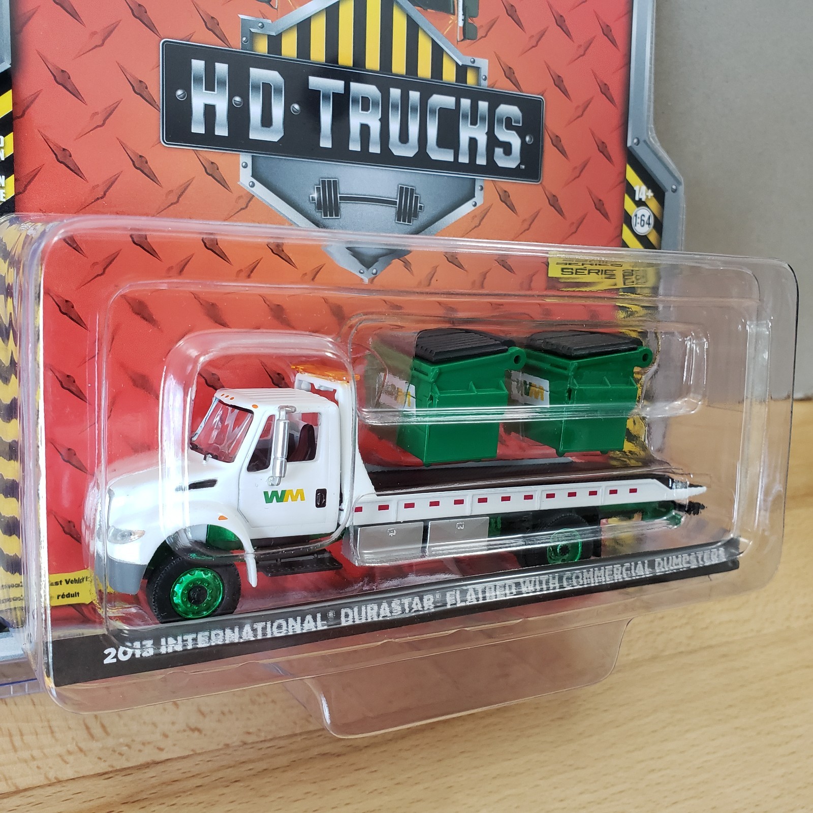 Greenlight 2013 International DuraStar Flatbed with Commercial Dumpsters 1:64