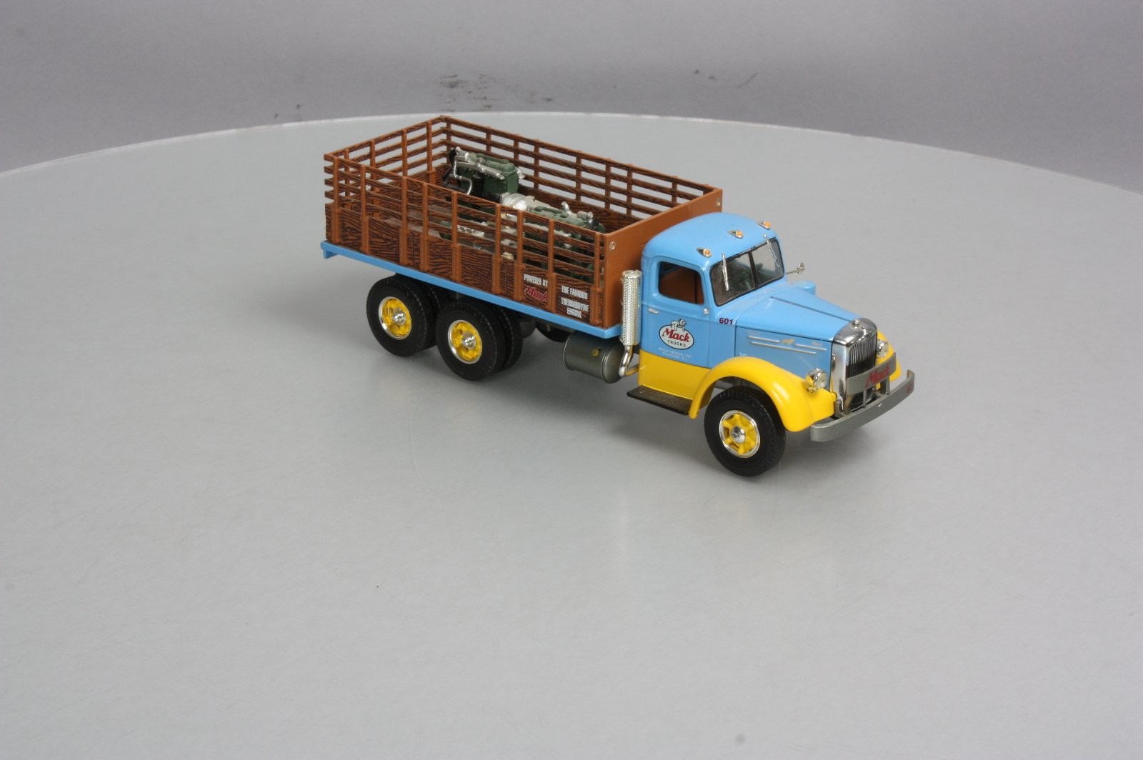 First Gear 19-3155 1:34 Scale Diecast Mack L Series Stake Truck with Engine Load