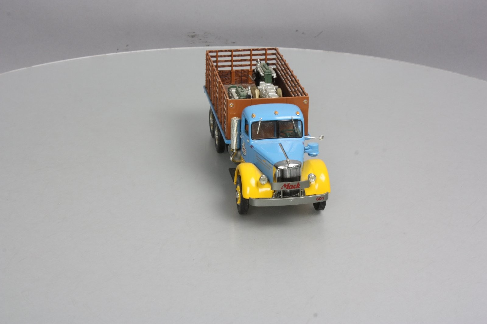 First Gear 19-3155 1:34 Scale Diecast Mack L Series Stake Truck with Engine Load