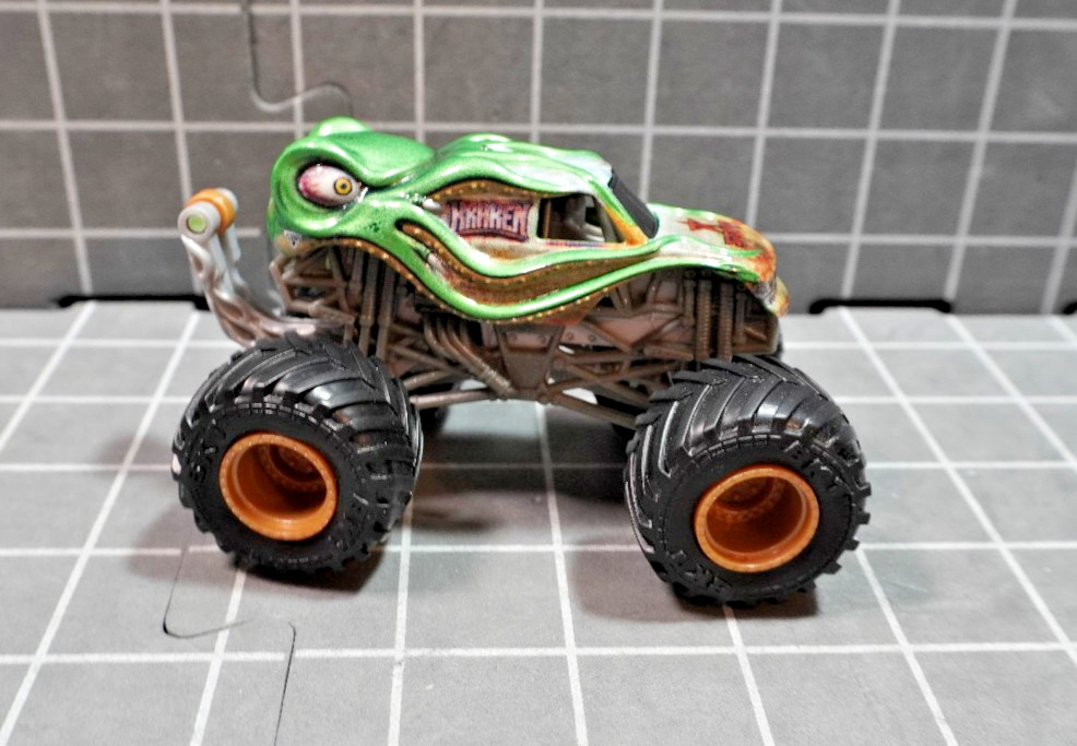 Lot of 4 Hot Wheels including Monster Jam Gears and Galaxies Pirates Curse 1/64