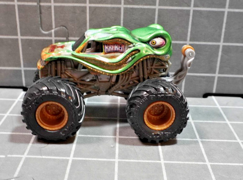 Lot of 4 Hot Wheels including Monster Jam Gears and Galaxies Pirates Curse 1/64