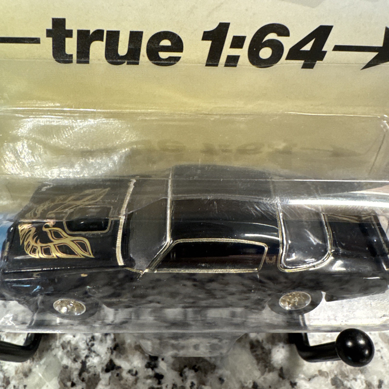 Auto World 1/64 1976 Pontiac Firebird T/A Toy Car – Gloss Black/Gold Bird…