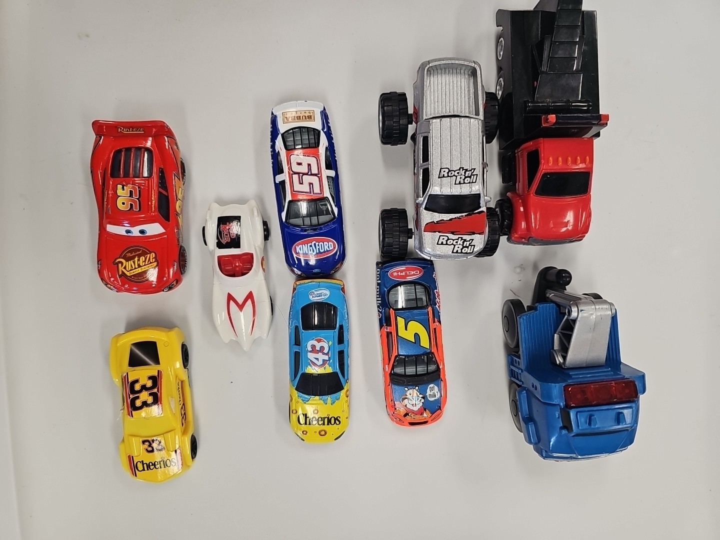 Lot Of 9 Assorted Die-Cast And Plastic Toy Cars Assorted manufacturing.