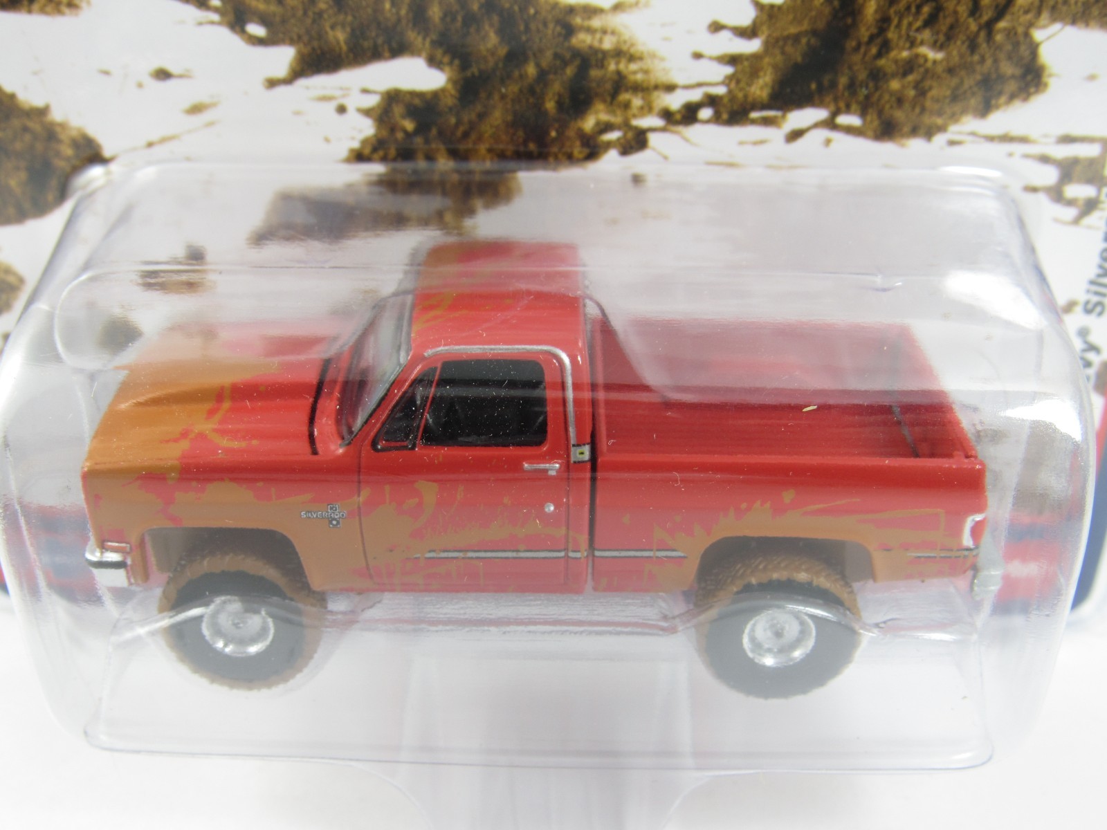 Auto World 1:64 2022 Muddin’ USA R1: Lifted Muddy 1983 CHEVROLET SILVERADO K10