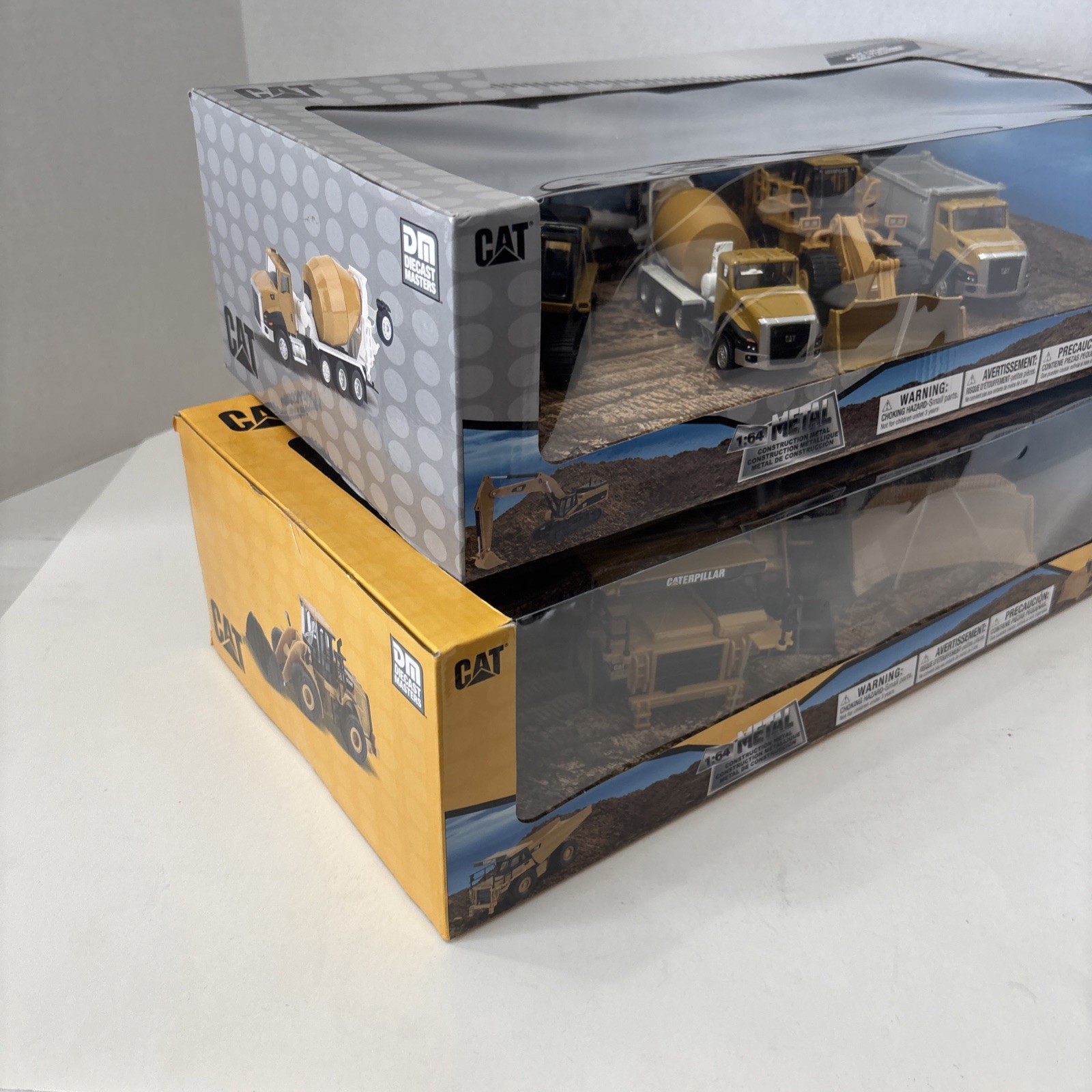 Diecast Masters 1:64 CATERPILLAR Metal Construction Trucks 2 Sets Of 4 – SEALED