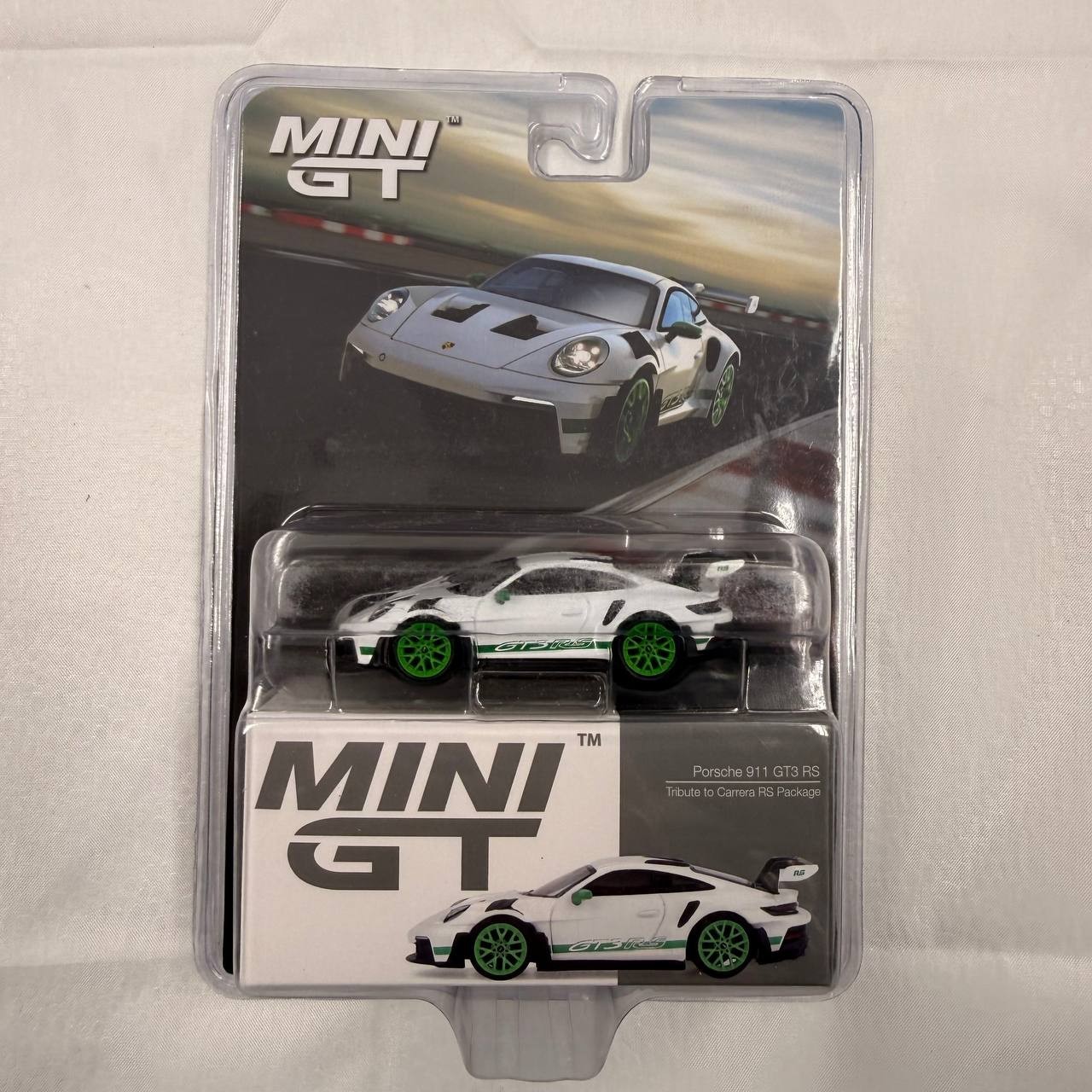 Two MINI GT Porsche 911 GT3 R White Carbon Package AO Racing Rexy Pink 1/64