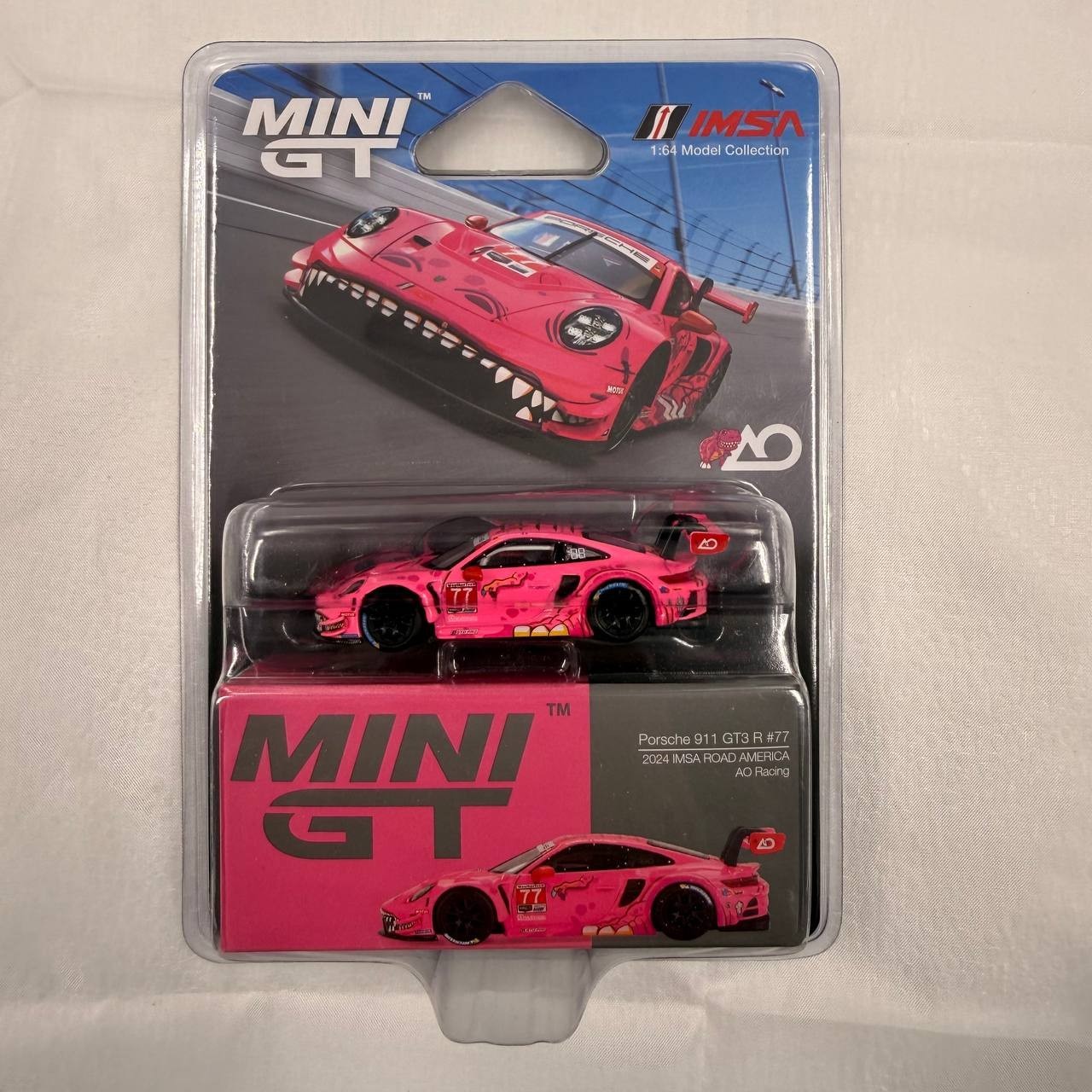 Two MINI GT Porsche 911 GT3 R White Carbon Package AO Racing Rexy Pink 1/64