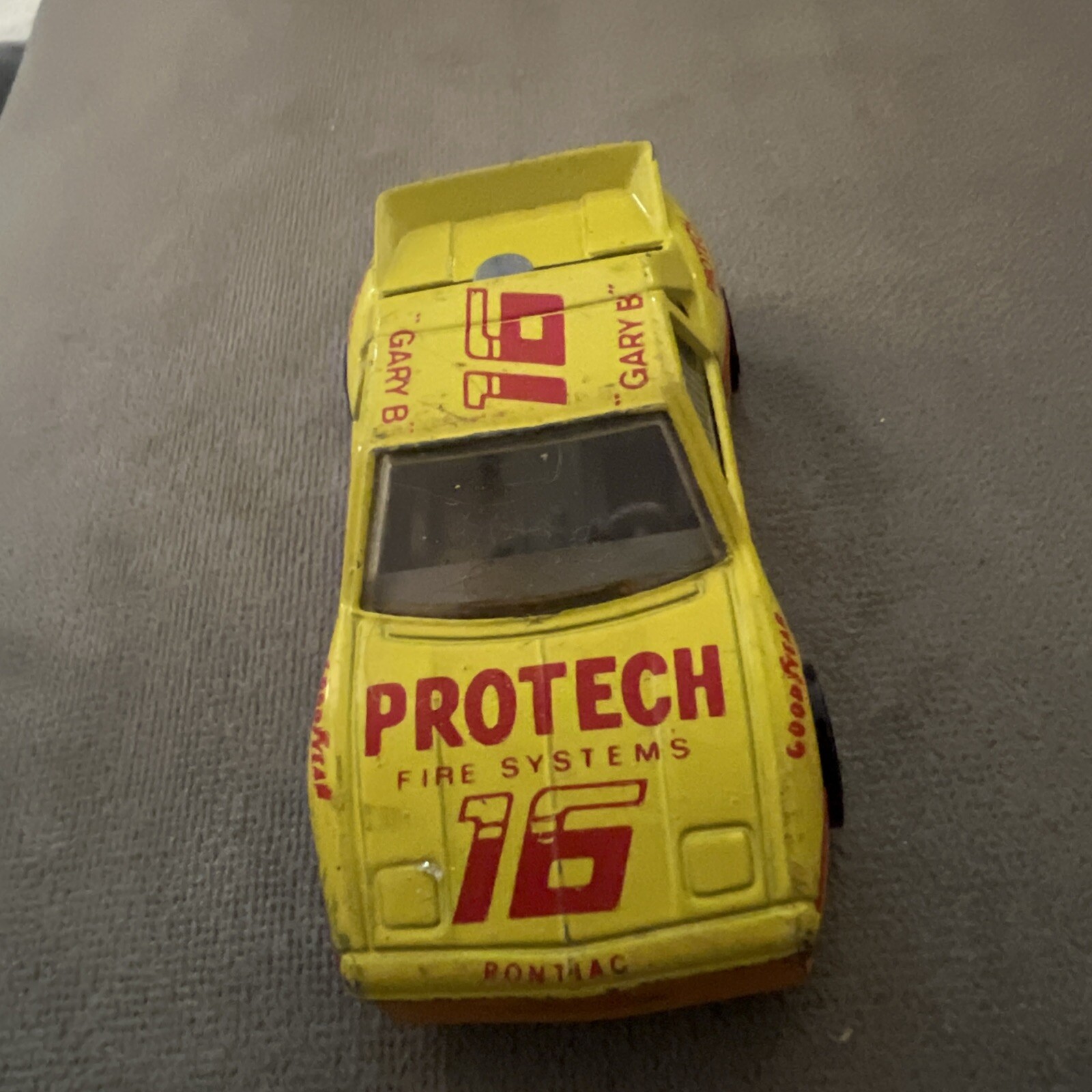 1985 Matchbox SuperFast SF19 Pontiac Fiero #16 ProTech Fire Systems Yellow LOOSE