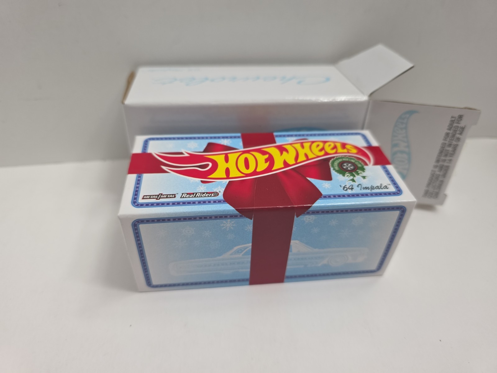 Hot Wheels 2021 RLC Holiday Snowman Chevy ’64 Impala – Spectraflame Light Blue
