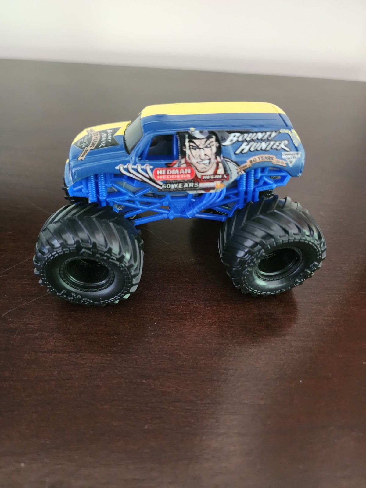 Bounty Hunter monster jam 1:64 diecast 20 years blue and yellow