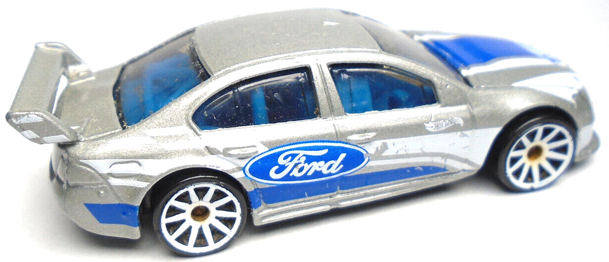 2021 HOT WHEELS FORD FALCON SILVER 1:64 DIECAST 3″ RACE CAR WITH BLUE & WHITE
