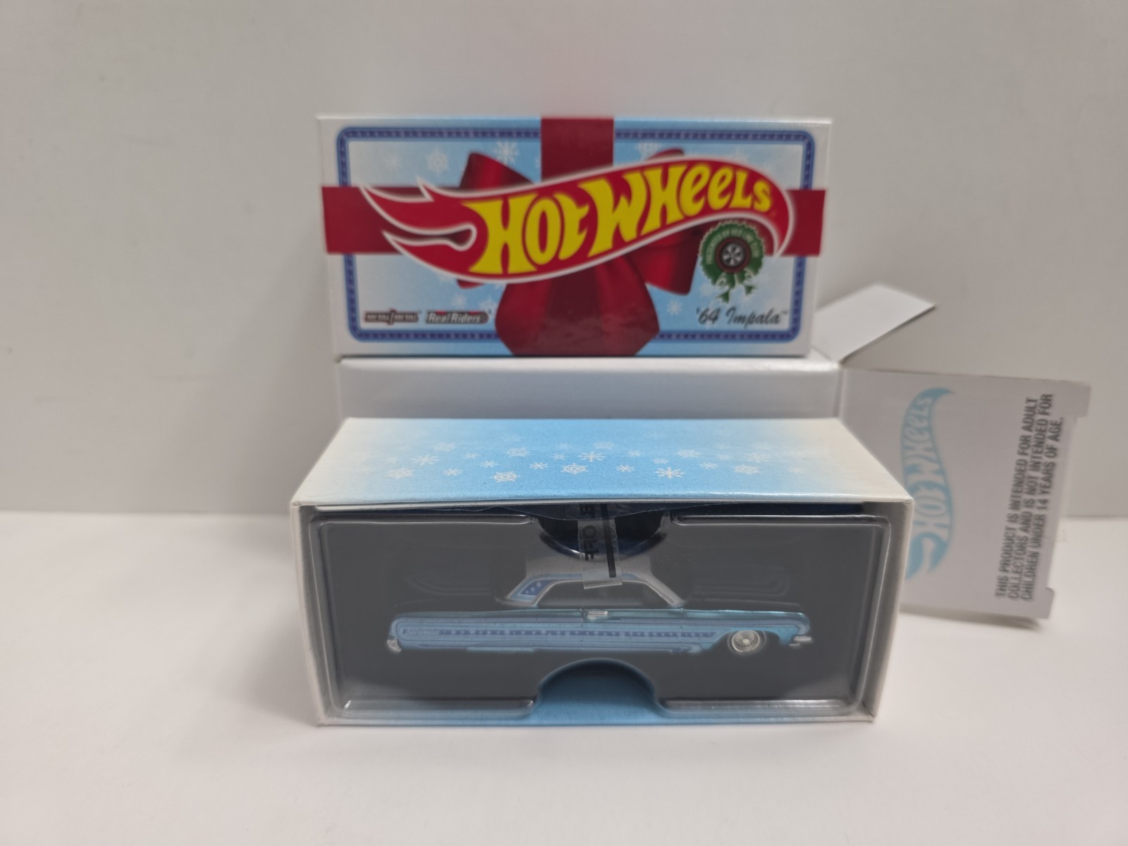 Hot Wheels 2021 RLC Holiday Snowman Chevy ’64 Impala – Spectraflame Light Blue