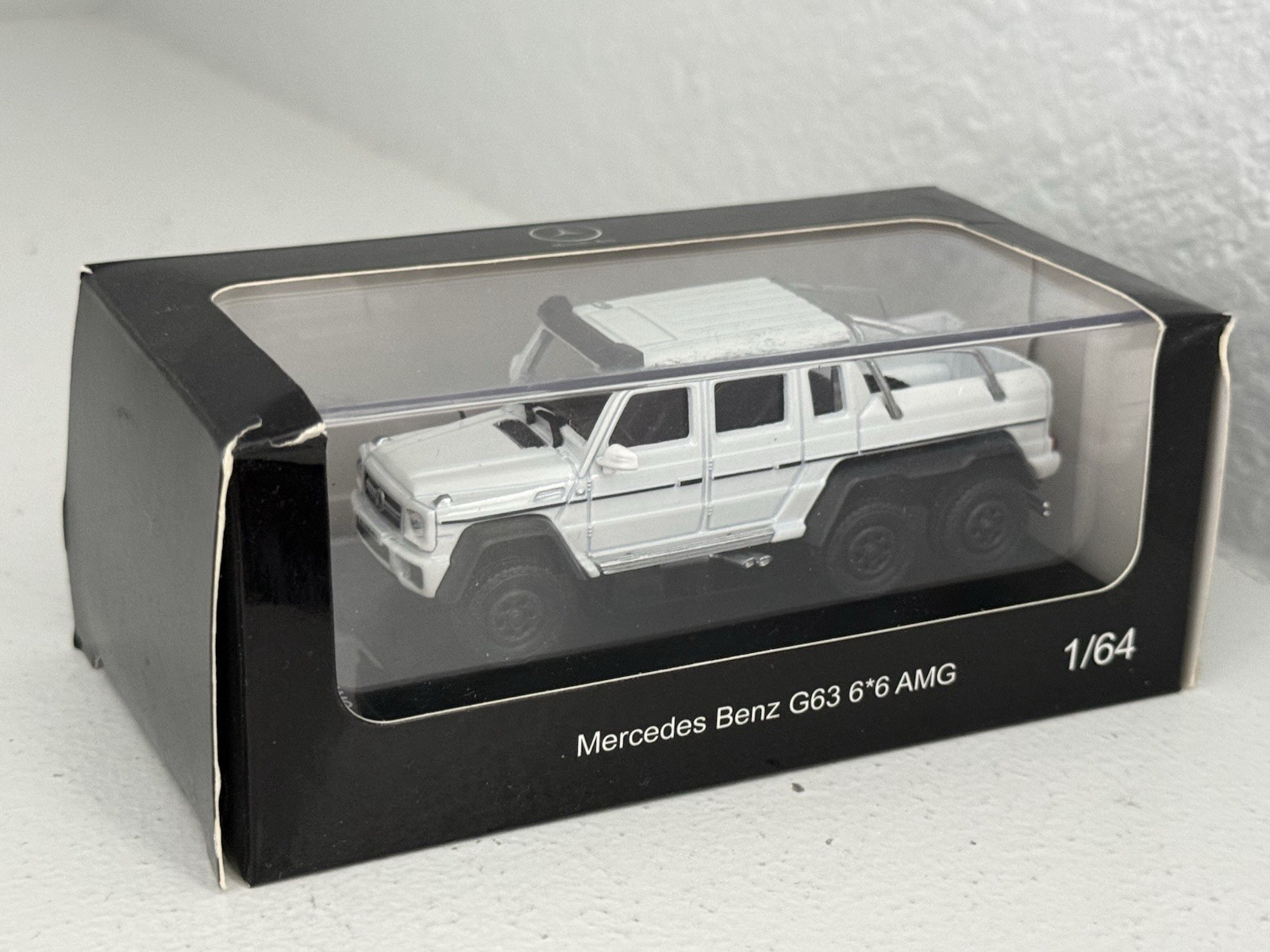 China 1:64 unbranded diecast Mercedes Benz G63 AMG 6×6 in white; premium model