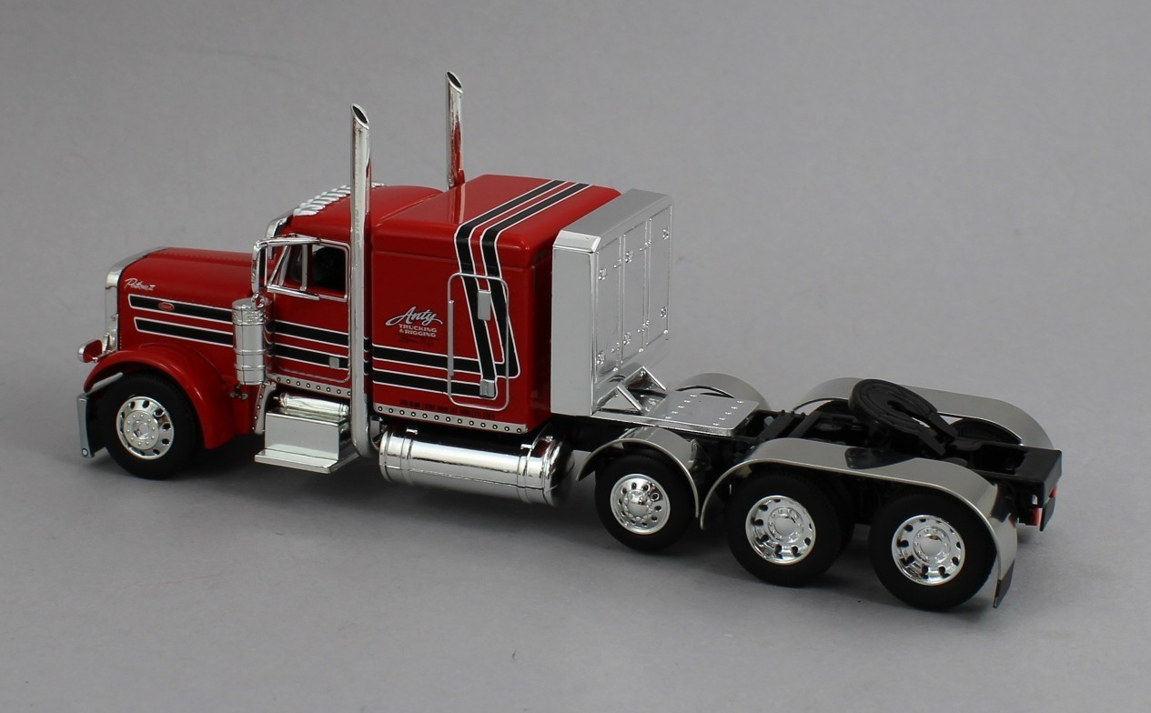 DCP 1:64 *ANTY TRUCKING* Peterbilt 379 63″ Flattop w/Tri-Axle LOWBOY Trailer NIB