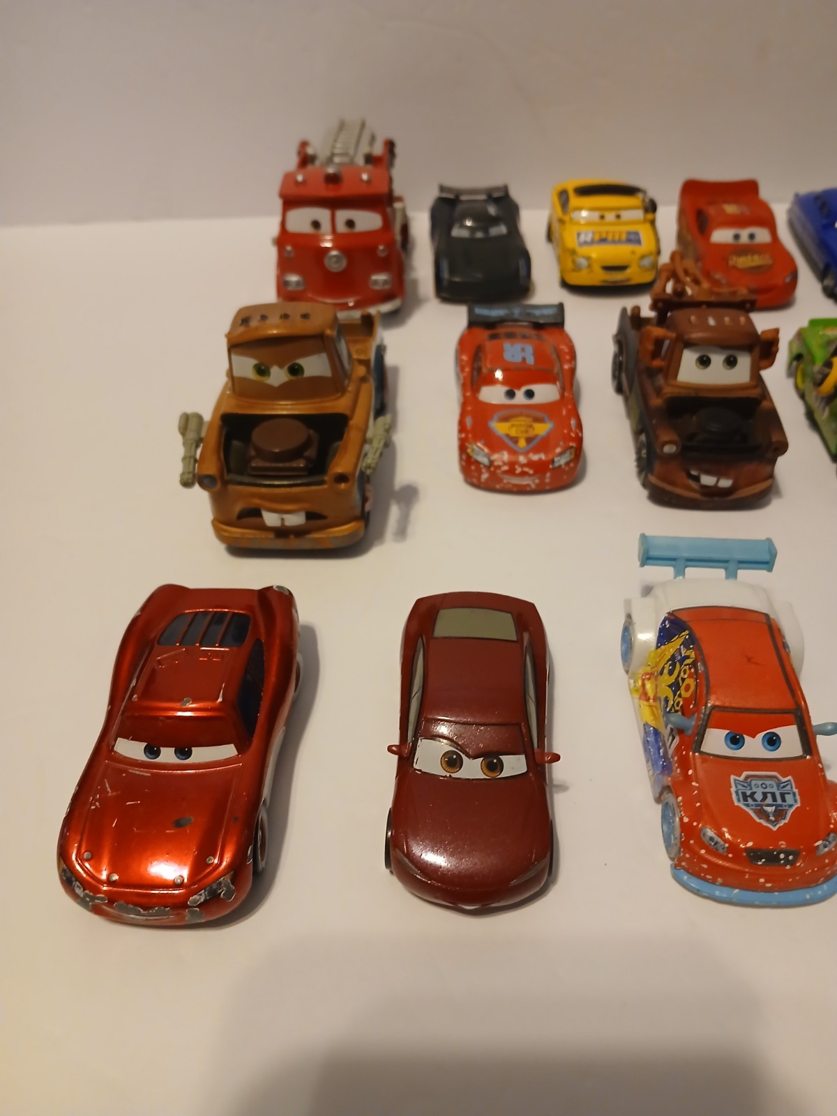 Disney Pixar Cars Lot Bundle of 26 Cars Die Cast And Plastic Lightning Mcqueen
