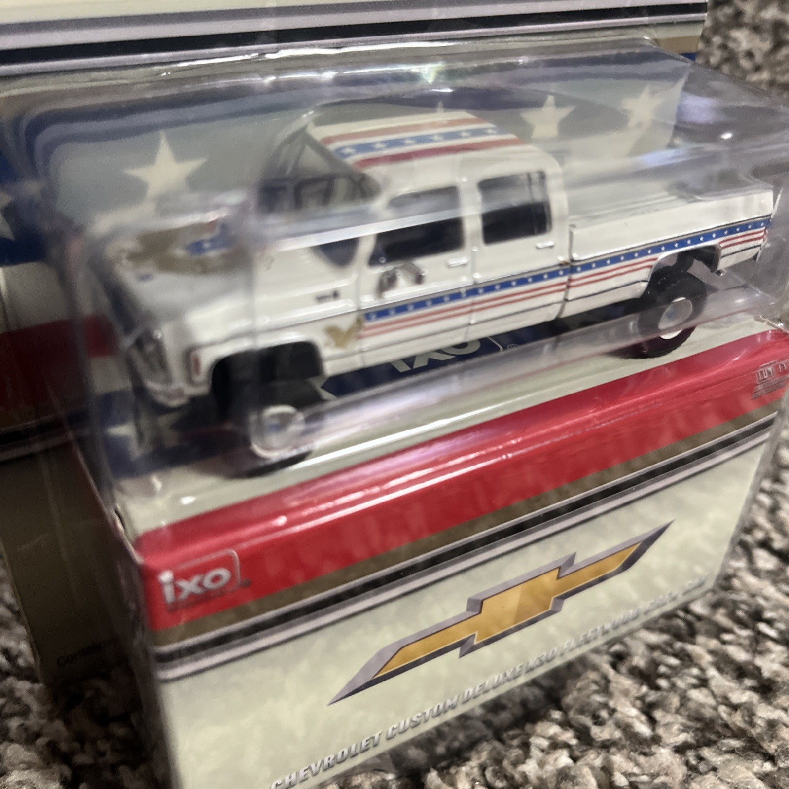 1:64 IXO 1976 Chevrolet Custom Deluxe K30 Fleetside Crew Cab- July 4th Exclusive