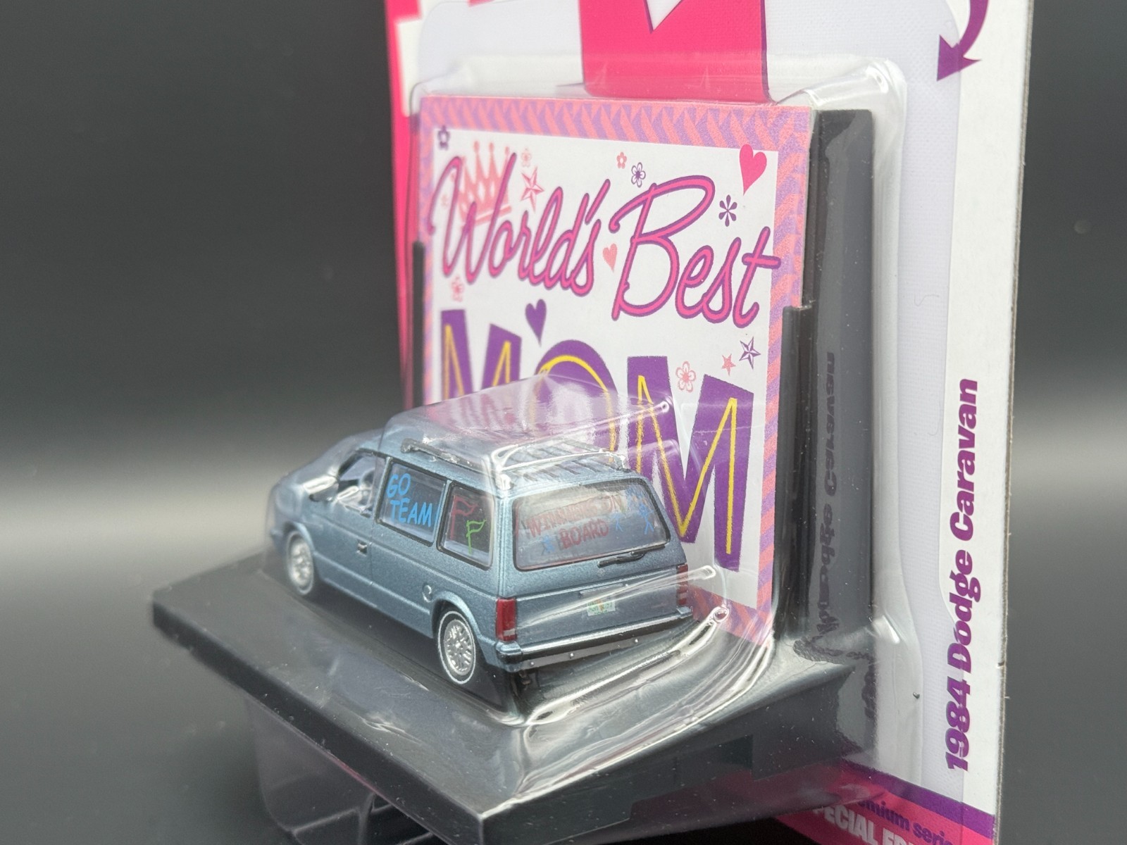 Auto World 1984 Dodge Caravan Blue World’s Best 1/64