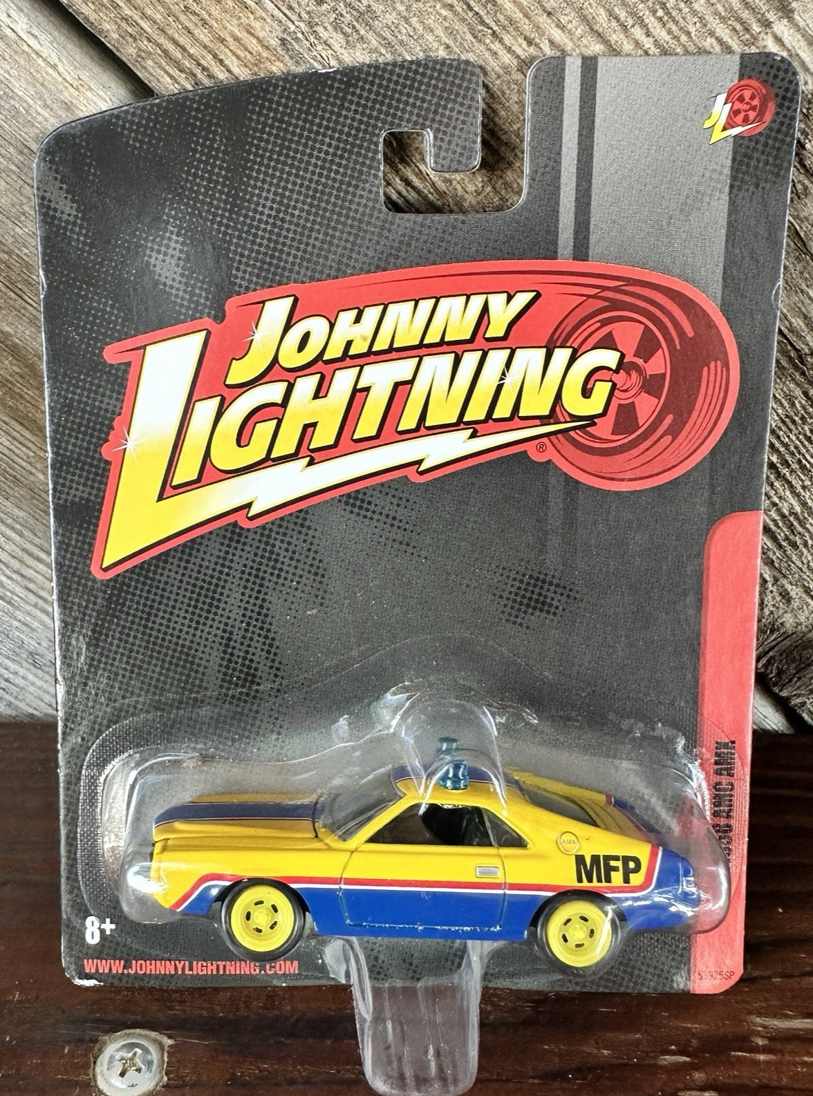 JOHNNY LIGHTNING 1968 AMC AMX IN BLUE AND YELLOW ‘MFP’ FROM MAD MAX