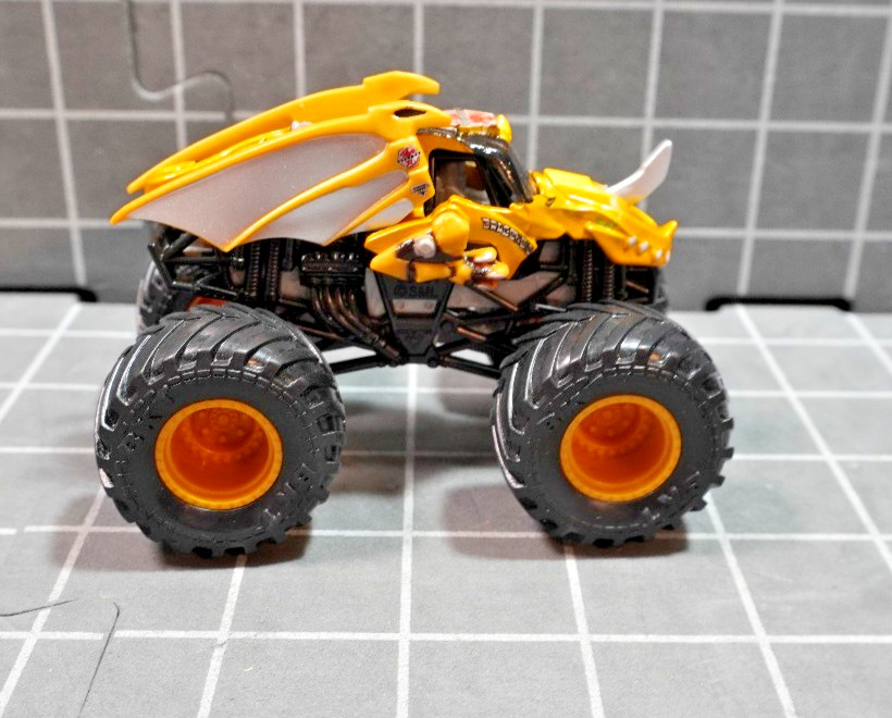 Lot of 4 Hot Wheels including Monster Jam Gears and Galaxies Pirates Curse 1/64