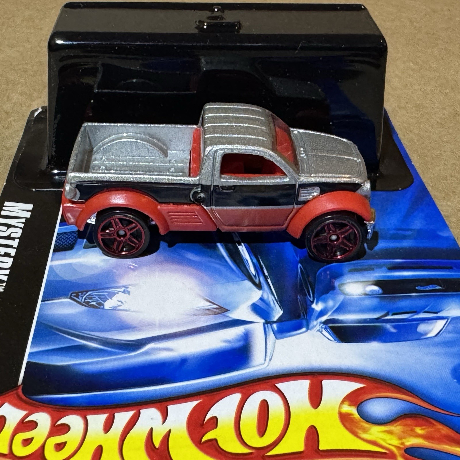 2007Hot Wheels Mystery Car Dodge M80 Pickup Truck Open w/Original Packaging