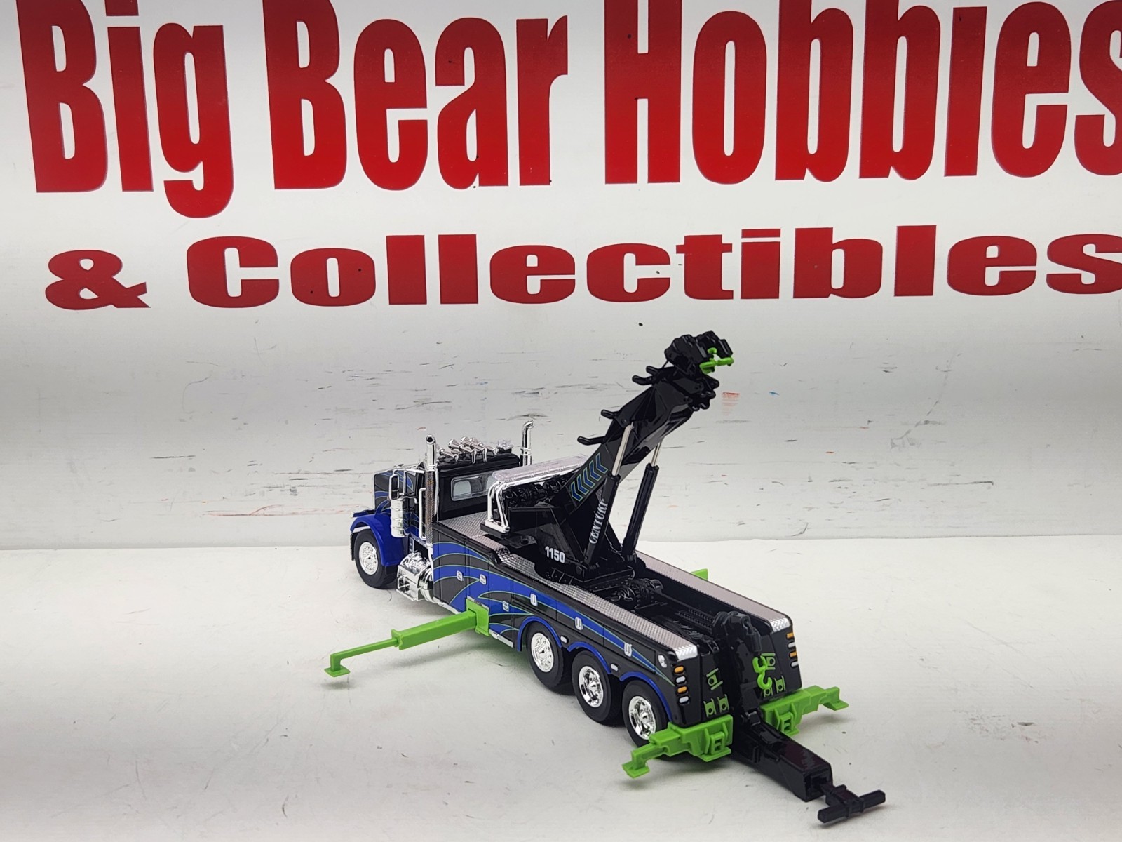 1/64 DCP/FG #60-2248 Black, Blue, & Green 389 DC Peterbilt Century 1150 Rotator