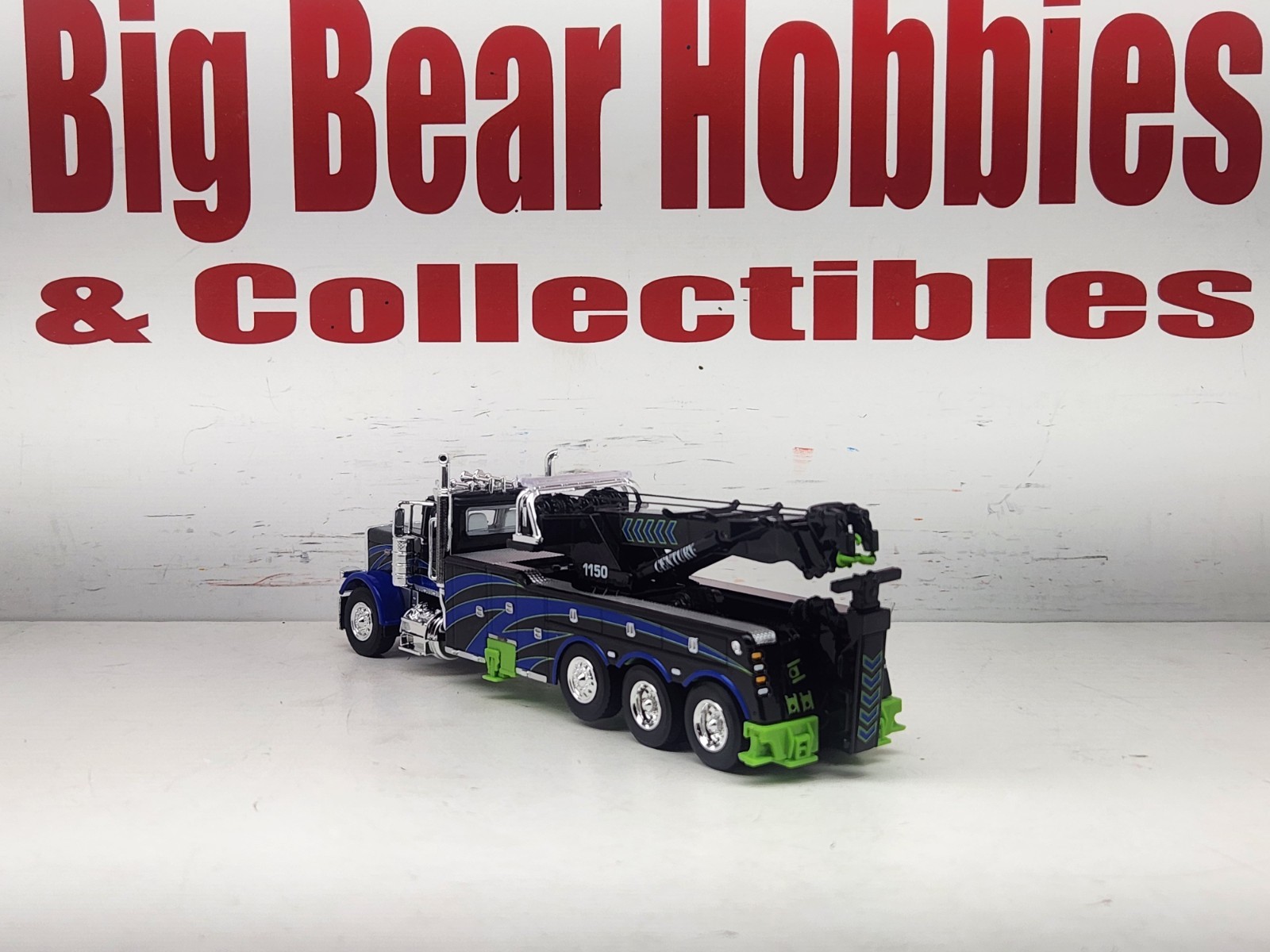 1/64 DCP/FG #60-2248 Black, Blue, & Green 389 DC Peterbilt Century 1150 Rotator