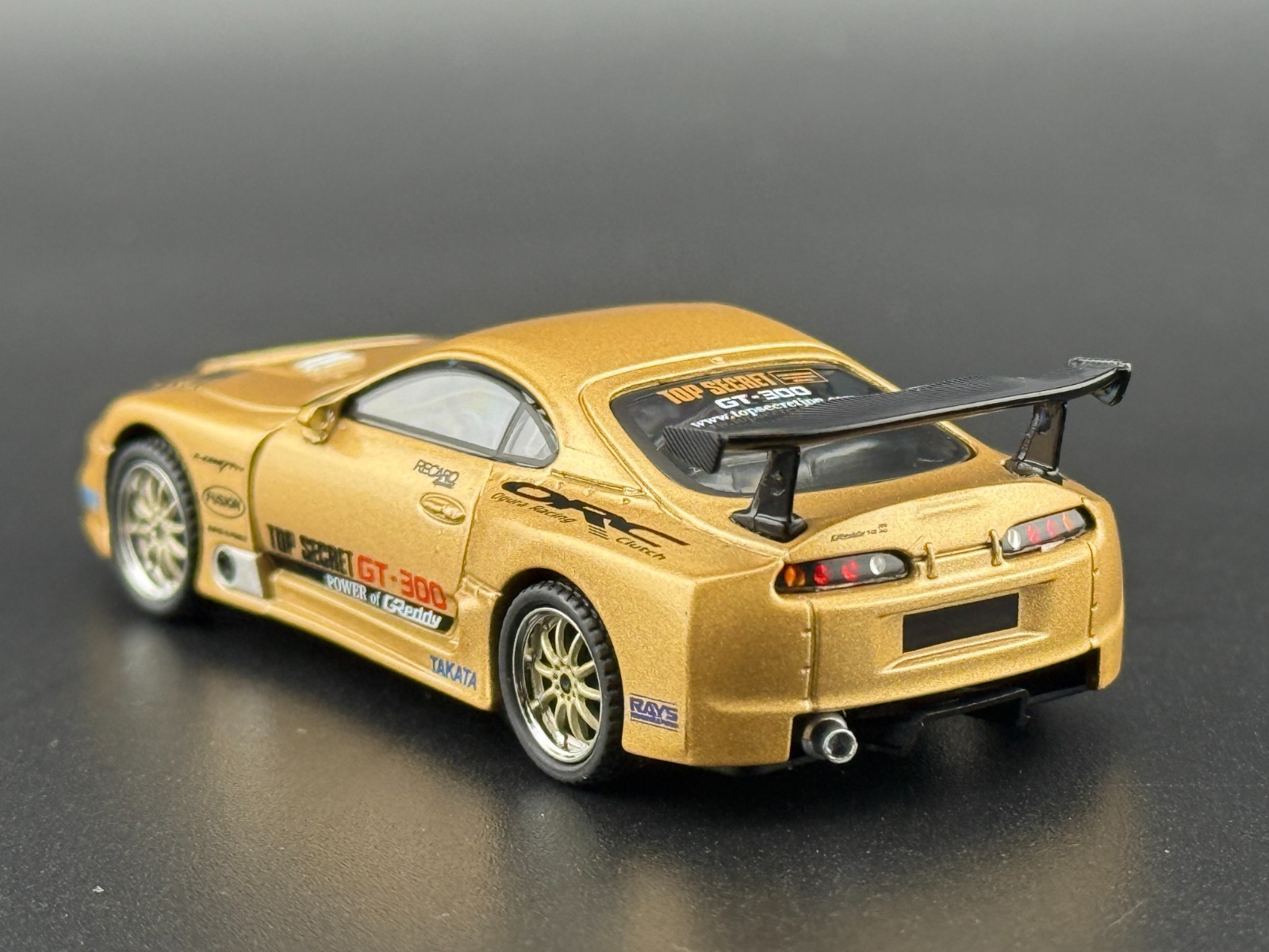 Mini GT Toyota Supra (A80) Top Secret GT-300 – Top Secret Gold #961 1/64