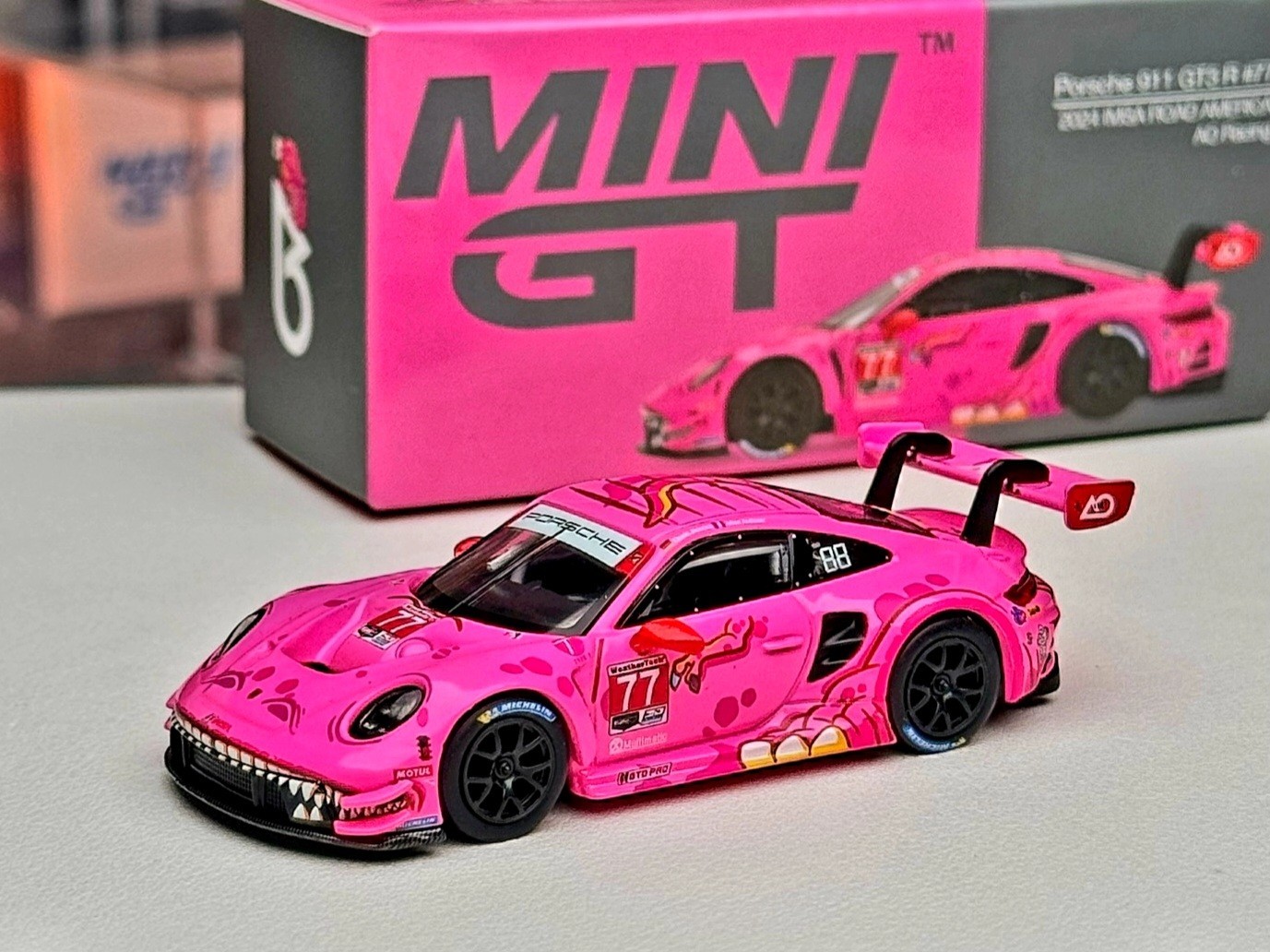 Mini GT 1:64 Porsche 911 GT3 R #77 AO Racing 2024 IMSA ROAD AMERICA