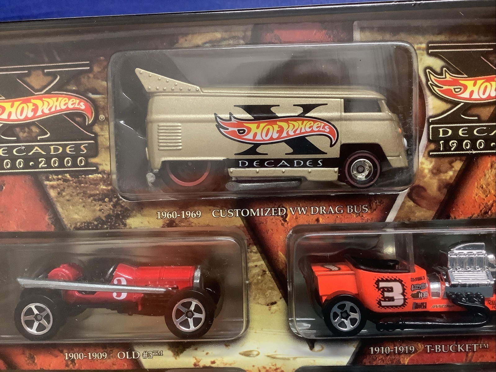 Hot Wheels Decades 1900-2000 Ten Vehicles Cars In Tin with Stand Box