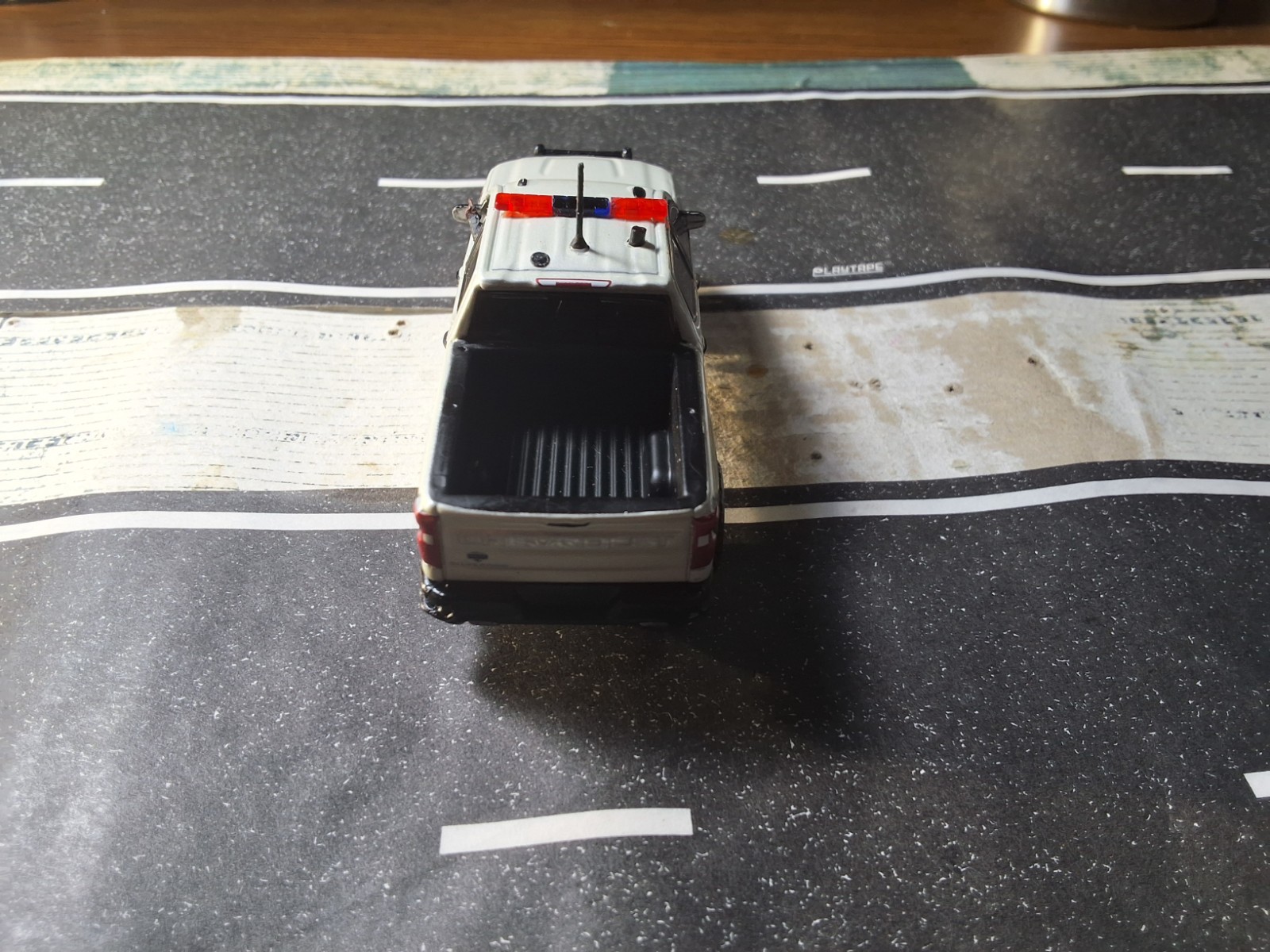 Greenlight Police Custom 1/64 Chevy Silverado SSV with Police Officer Driving