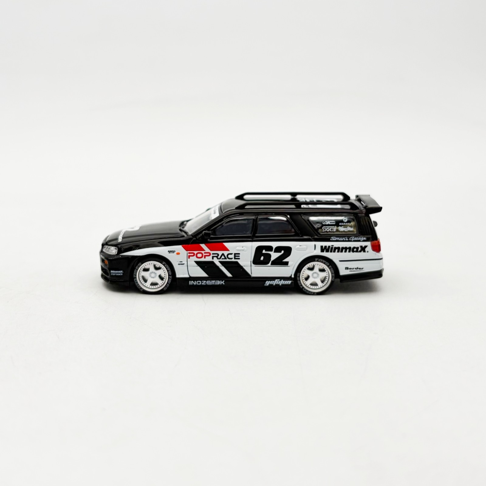 Pop Race 1:64 Nissan Stagea R34 Black #211