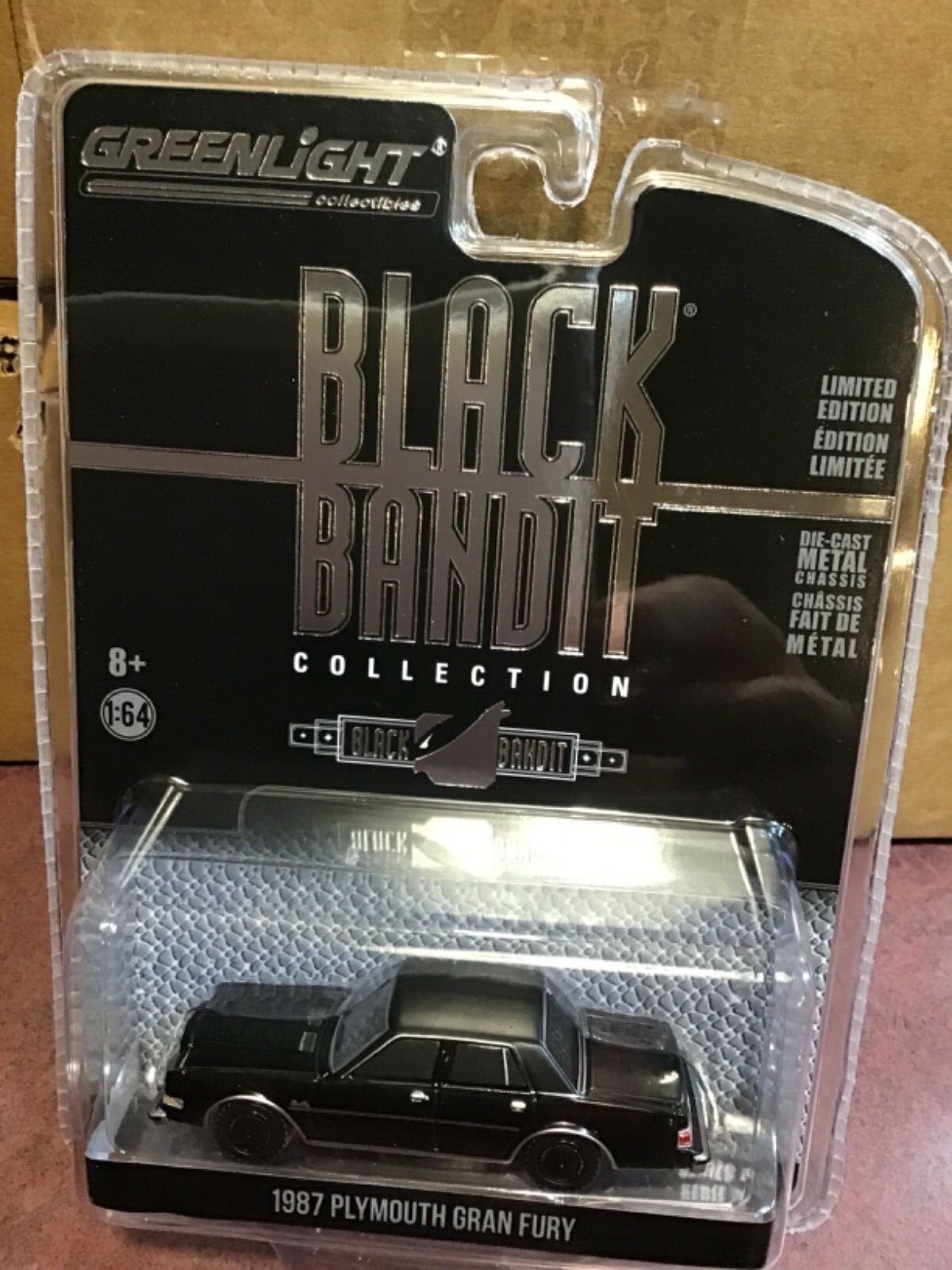 Greenlight Black Bandit 24. 1987 Plymouth Gran Fury